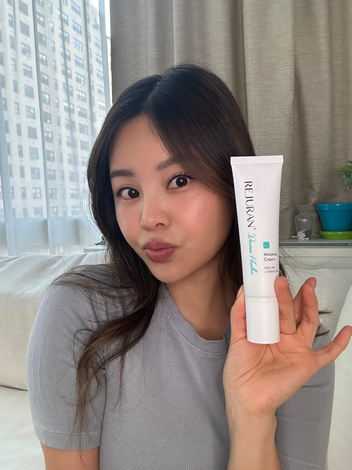 REJURAN Moisture Cream glow after application on skin