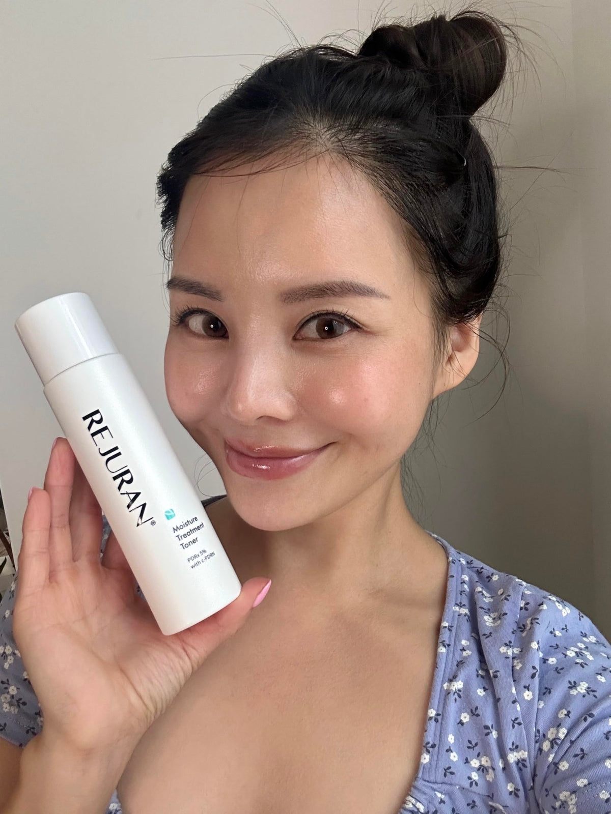 REJURAN Moisture Toner resting on a bathroom shelf, ready for daily use.