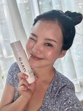 REJURAN Moisture Toner minimalist bottle on a neutral surface.