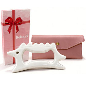RelaxaX ceramic gua sha face tool for lifting and contouring the cheekbones.