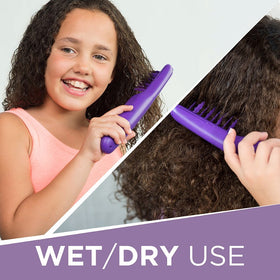 Remington Tame the Mane in use on wet hair for smooth detangling.