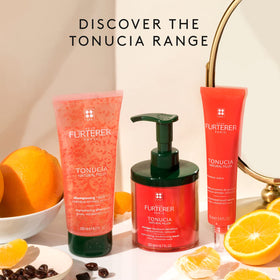 Rene Furterer Tonucia Replumping Shampoo on hair strands suggests instant fullness.