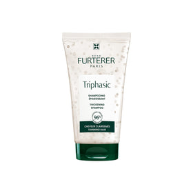 René Furterer Triphasic Strengthening Shampoo bottle demonstrates energized scalp and fuller-looking hair.