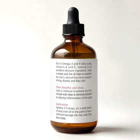 Renewalize Sacha Inchi Oil bottle pour showing easy, fast absorption for daily skincare.