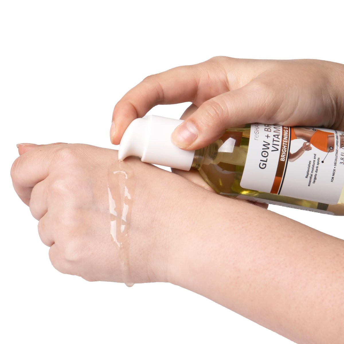 Reshape+ Vitamin C Body Oil pump dispensing for easy application