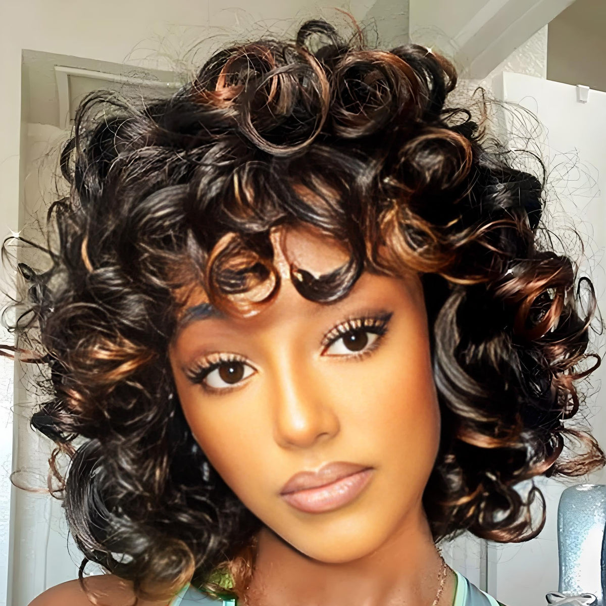 Retoleca Afro-textured wig side view shows voluminous curls for party-ready looks.