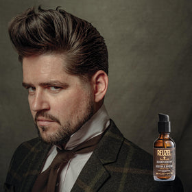 REUZEL beard care setup with citrus mint scent.