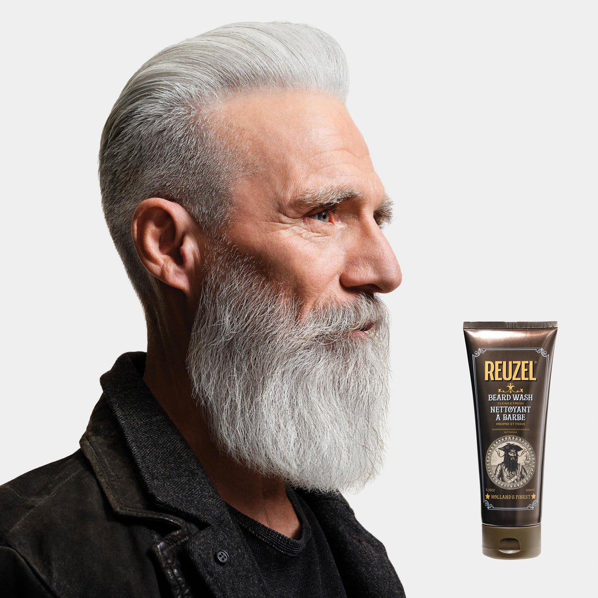 Hands applying REUZEL beard wash for a clean, soft, hydrated beard.