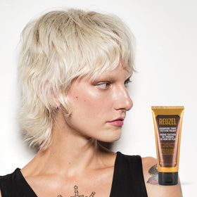 Close-up of cap on REUZEL Texture Cream shows clean, controlled application.
