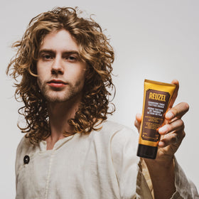 Dispense action demonstrates quick, hassle-free shaping of styles with REUZEL Texture Cream.