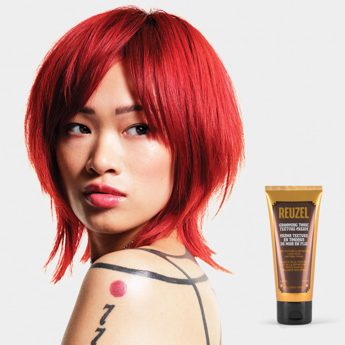 Bottle highlights natural shine for a polished look after styling with REUZEL.