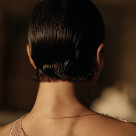 Sleek glossy finish achieved with Hymn Hair Gel