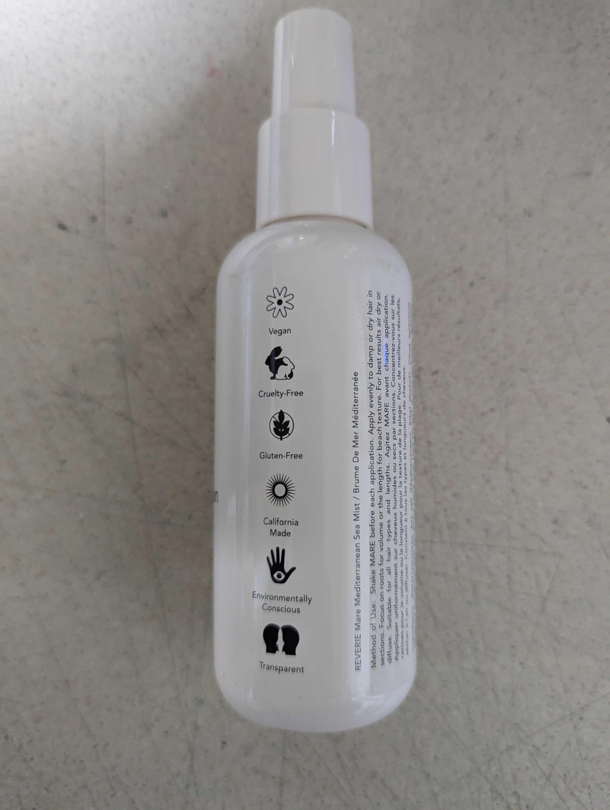 REVERIE Natural Mare Sea Mist fragrance notes swirl behind the spray