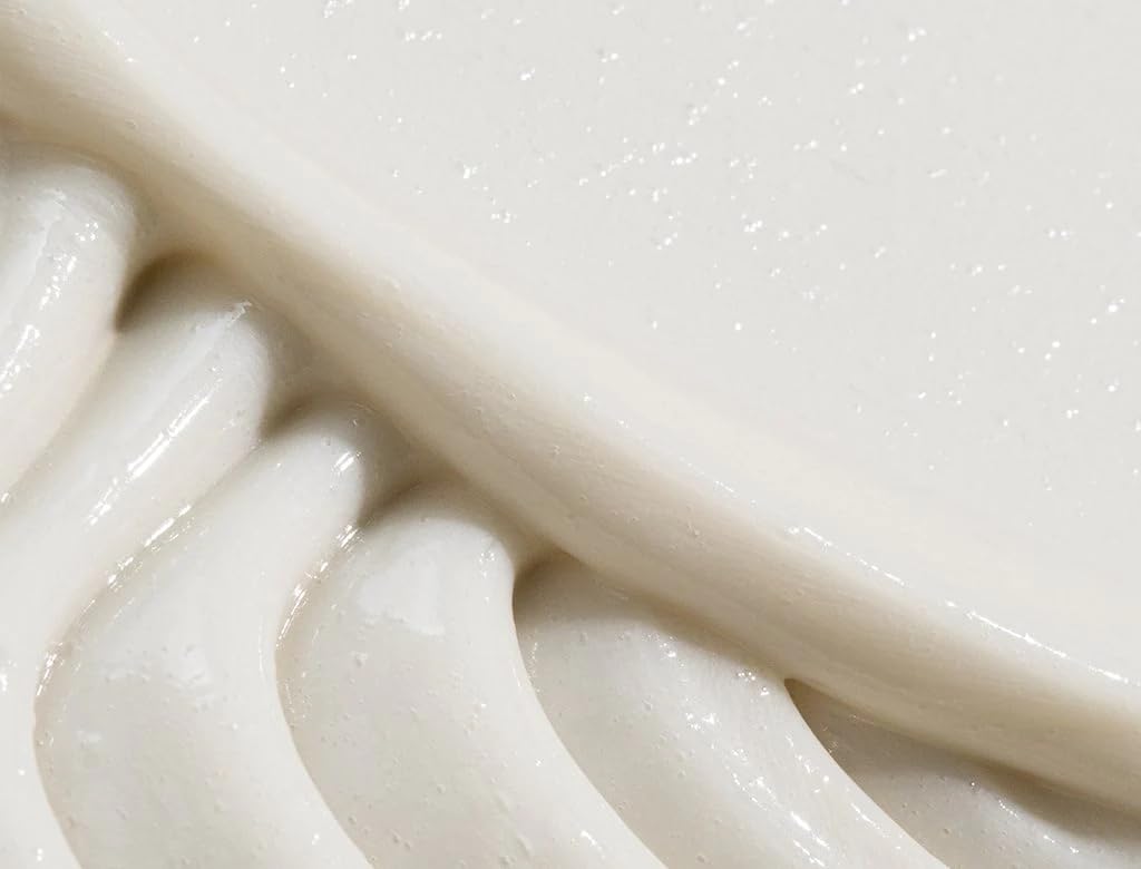 REVERIE Nourishing Conditioner cream texture highlights lightweight, smoothing glide.