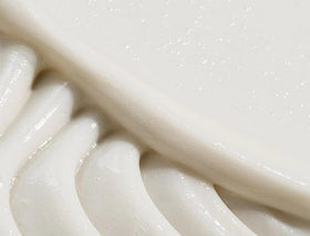 REVERIE Nourishing Conditioner cream texture highlights lightweight, smoothing glide.
