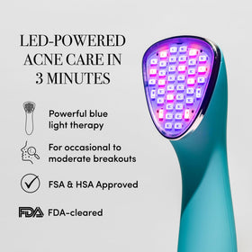 ReVive Clinical Acne Device close-up showing red light on blemish-prone skin