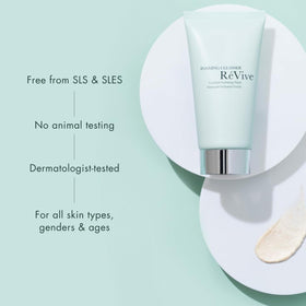 RéVive Cleanser model applying foam to face during routine.