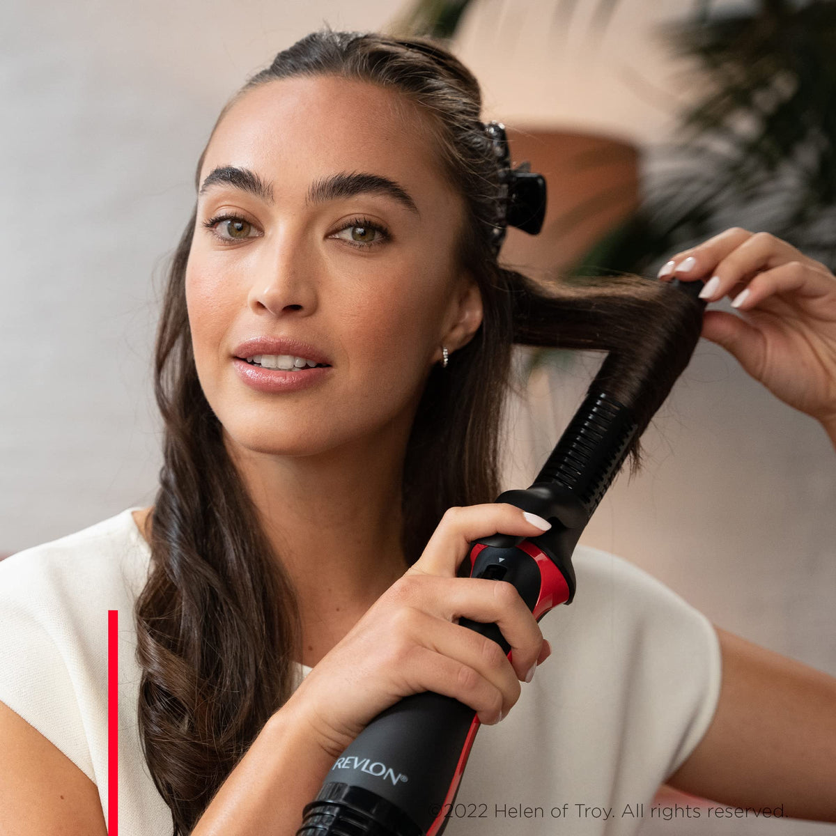 REVLON One-Step Blowout Styler 1 ¼” ceramic-coated barrel smooths hair.