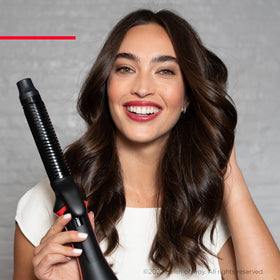 REVLON One-Step Blowout Styler with four heat settings for versatile styling.