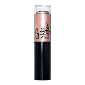 REVLON PhotoReady Insta-Fix Highlighter Stick Pink Light applied to the forehead center for a luminous touch.