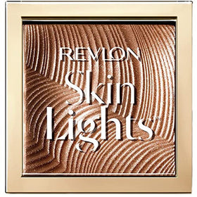 Revlon Skinlights Prismatic Bronzer Sunkissed Beam closeup reveals crystal pigments for a natural glow.