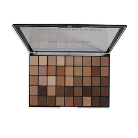 Close-up swatches of Revolution Maxi Reloaded showing matte and shimmer finishes.