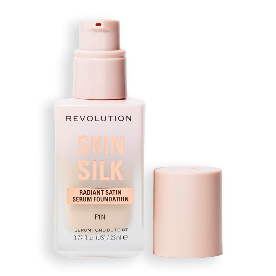 Revolution Skin Silk bottle close-up showing radiant satin finish for natural glow