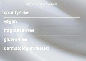Glass bottle and glow lighting highlight Rhode Barrier Restore Cream for nourishing skincare.