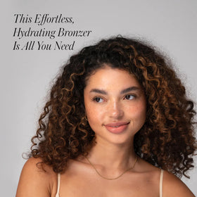 RMS Beauty Buriti bronzer on shoulders for sun-kissed glow