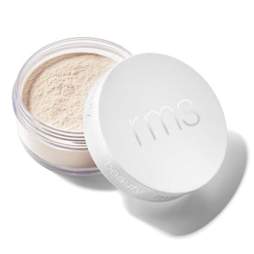 RMS Beauty Hydra Setting Powder compact close-up with talc-free formula for all-day wear.