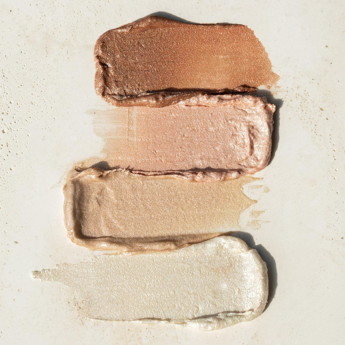 RMS Beauty Luminizer pearlescent glow for warm to cool complexions.