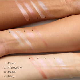 RMS Beauty Luminizer shoulders highlights collarbone with soft body shimmer.