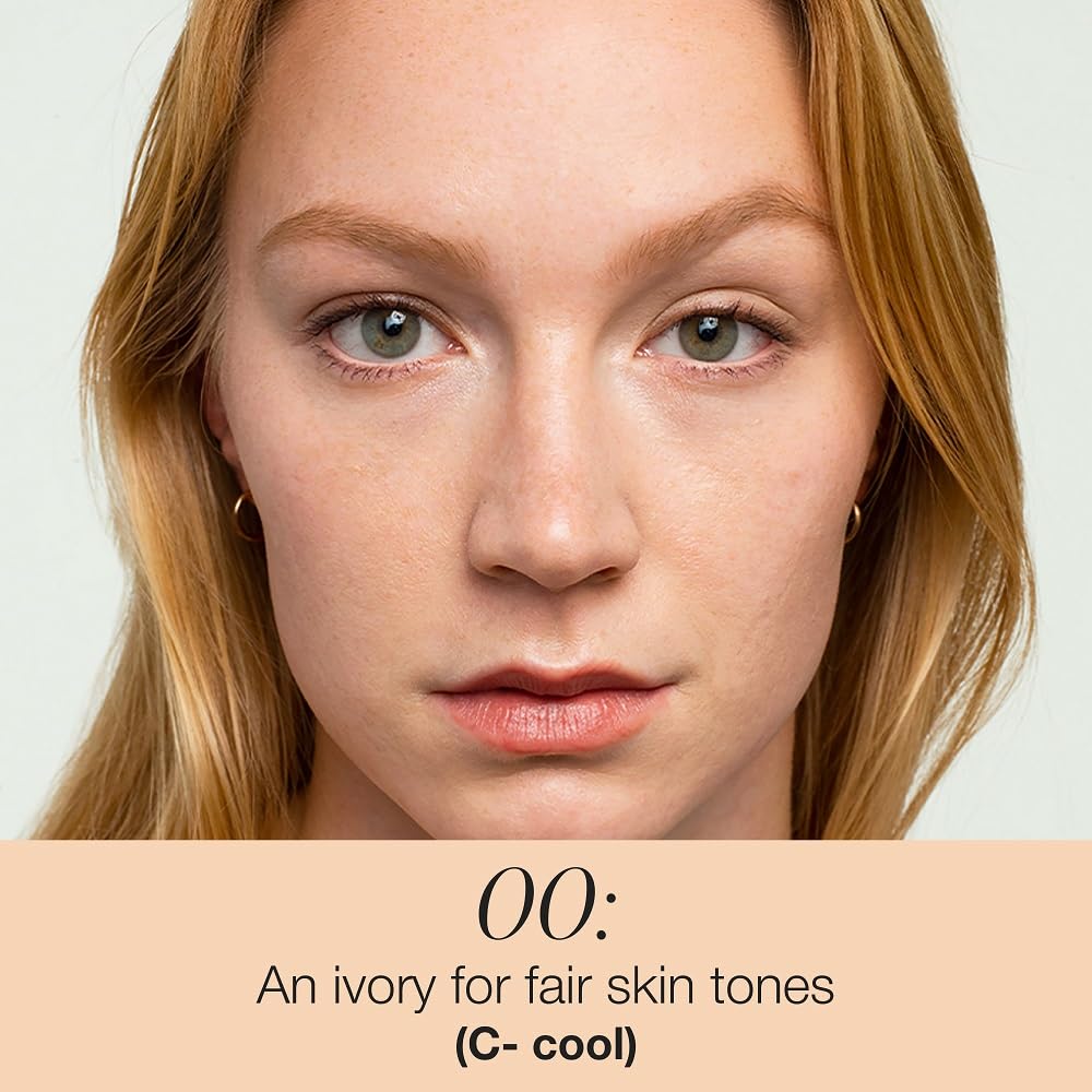 RMS Beauty UnCoverup concealer on dark circles providing skin-matching coverage.