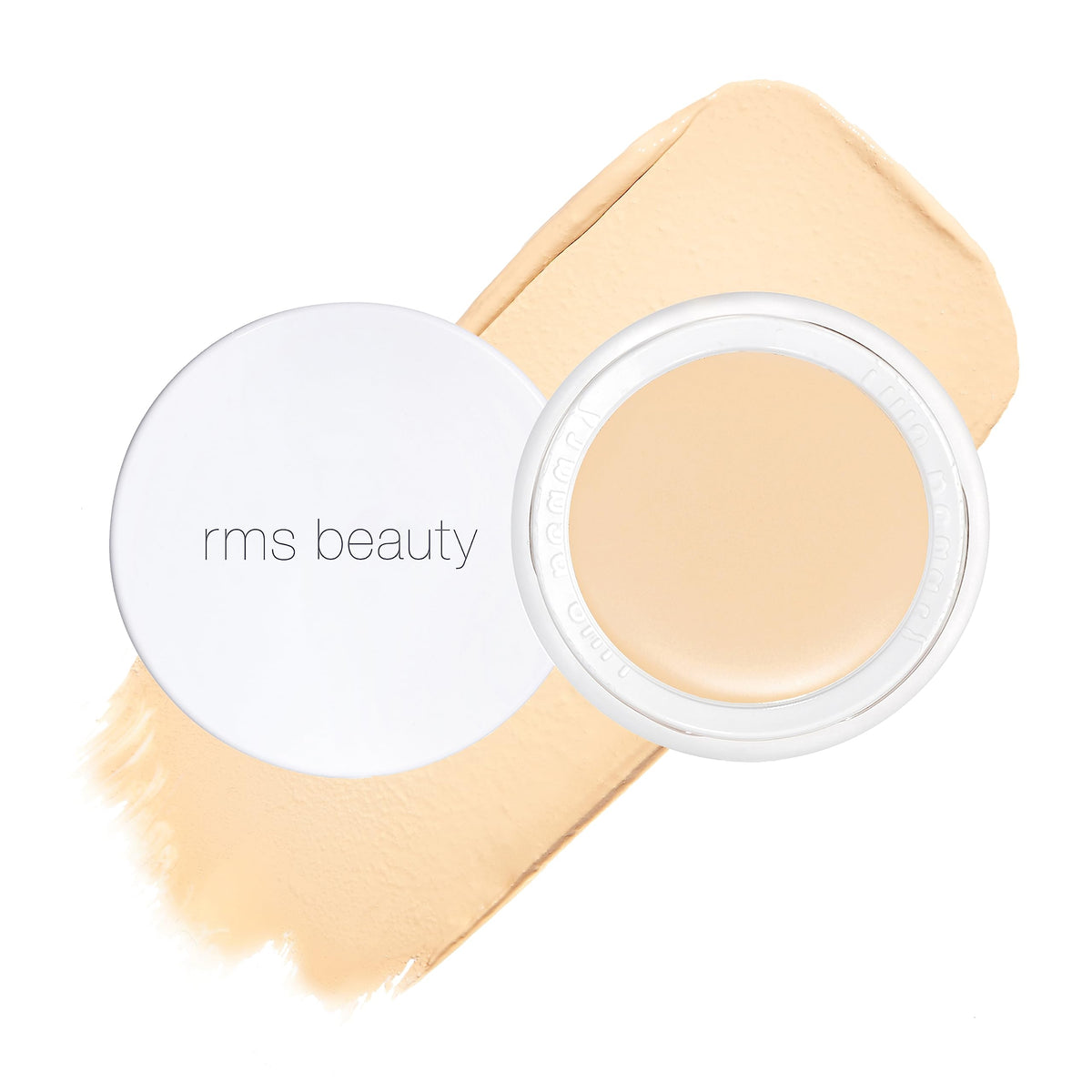 RMS Beauty UnCoverup concealer jar close-up showing creamy texture and natural finish.