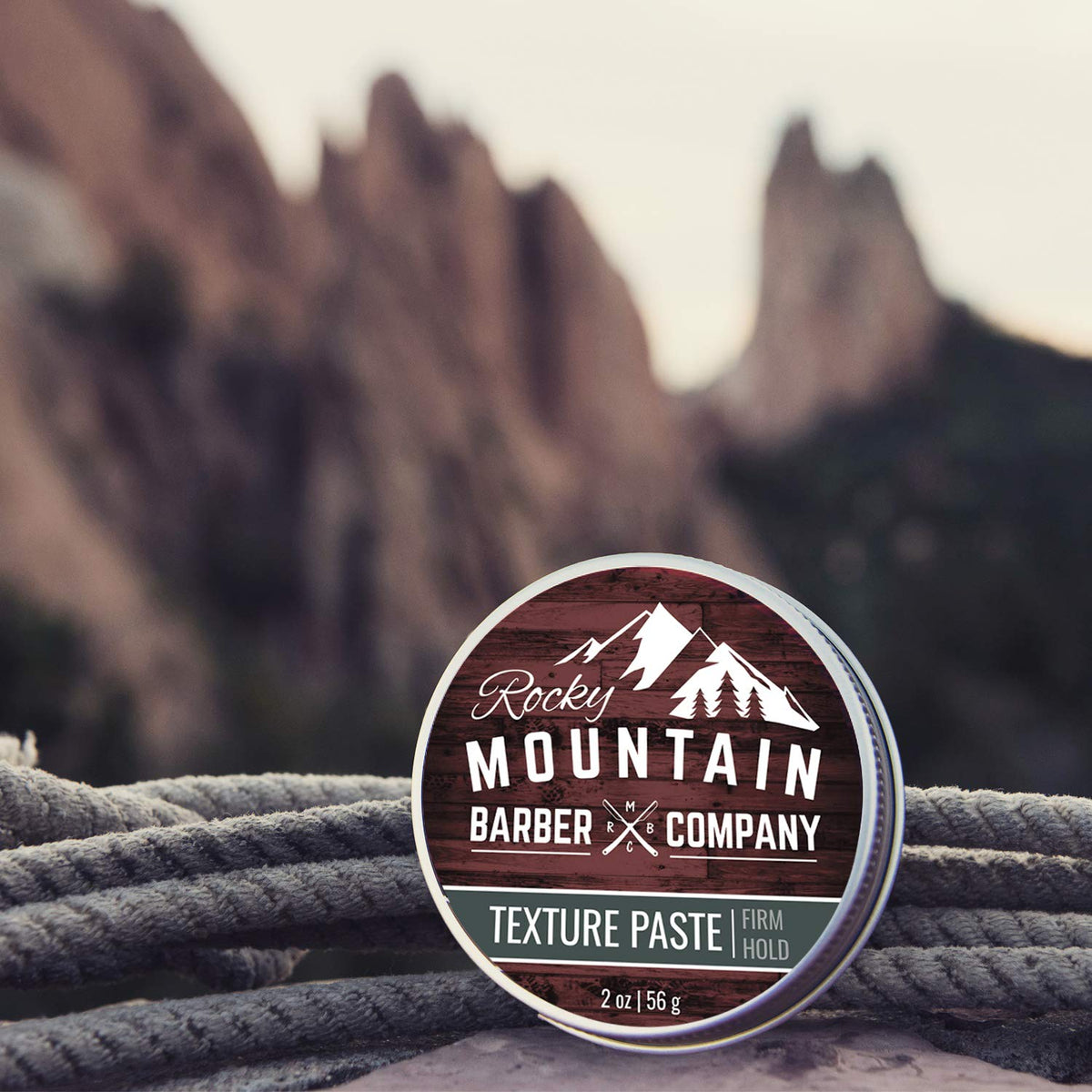 Rocky Mountain Barber Company two-ounce tin shown for travel-friendly styling.