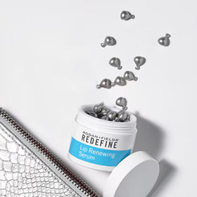 Rodan + Fields Lip Renewing Serum Capsules closeup showing a precise dose