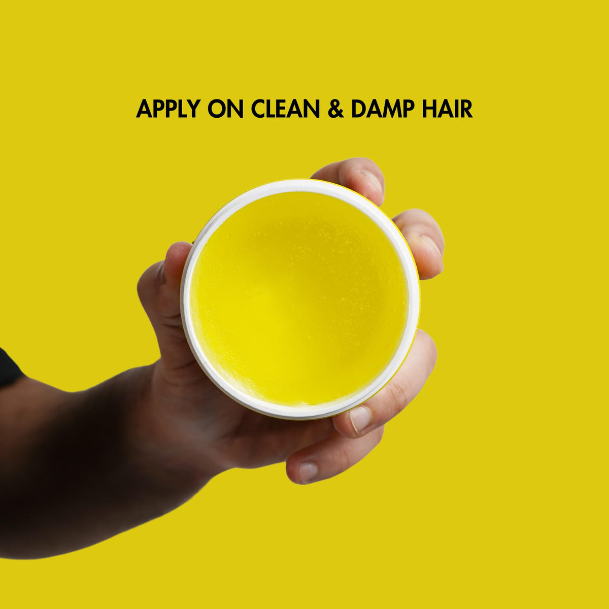 Rolda Sunset Pomade in hands demonstrates easy distribution for controlled styling.