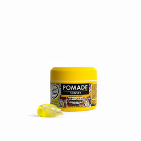 Rolda Sunset Hair Pomade jar close-up highlights compact tub for precise application.