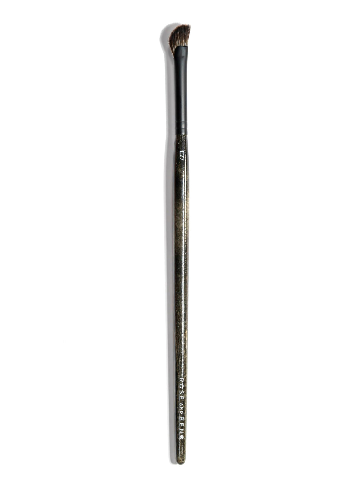 Rose and Ben Beauty E27 inner corner brush angled for precise highlight.
