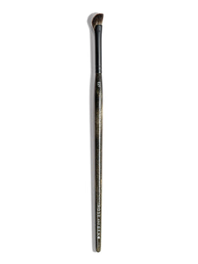 Rose and Ben Beauty E27 inner corner brush angled for precise highlight.
