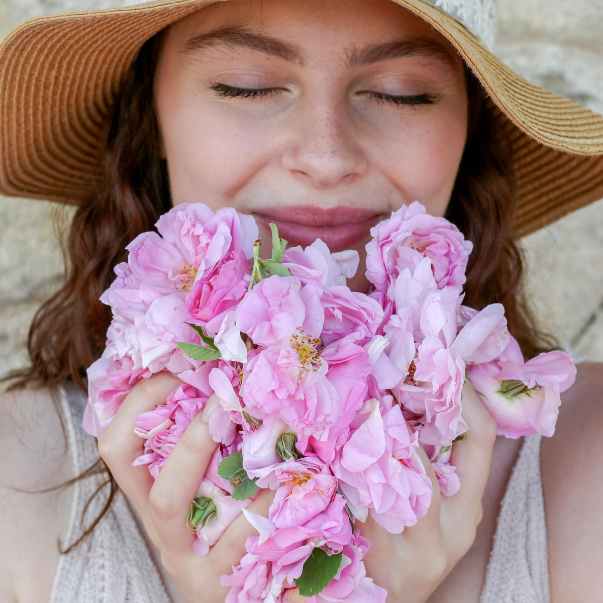 Silky rosewater in a glass bottle, luxurious sensory experience.