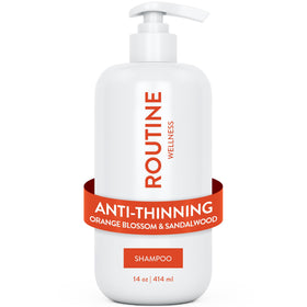 Routine Wellness anti-thinning shampoo bottle with orange blossom and sandalwood for fuller-looking hair.