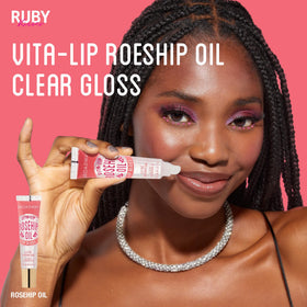 Swiped Vita-Lip gloss on lips demonstrating long-lasting gloss