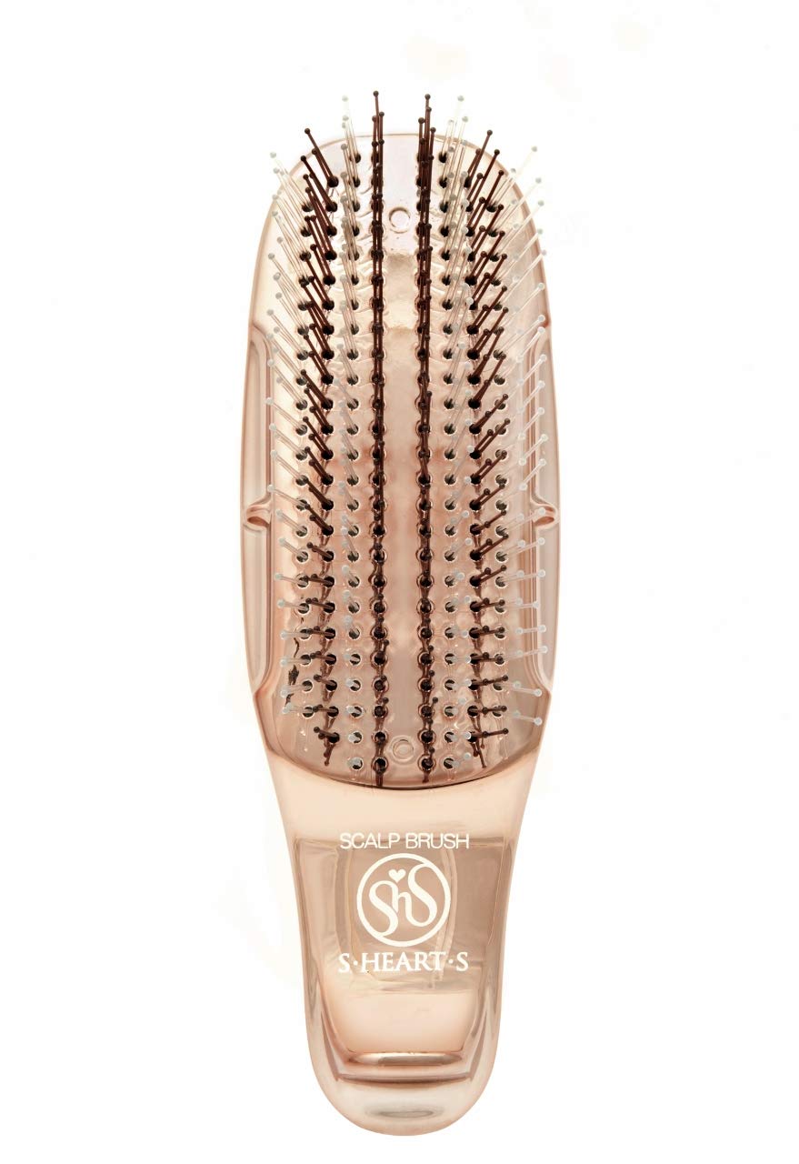 S-Heart-S scalp brush handle demonstrates ergonomic grip for easy use.