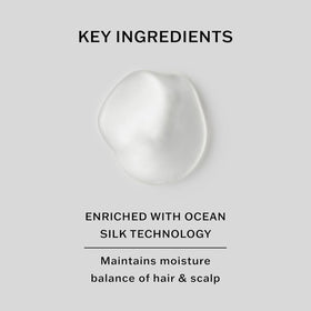 SACHAJUAN Normal Hair Shampoo bottle on sink emphasizing shine and volume.