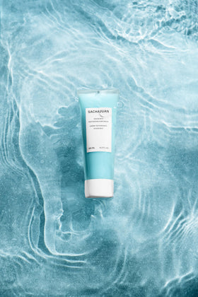 SACHAJUAN Ocean Mist being applied by hands to create texture.
