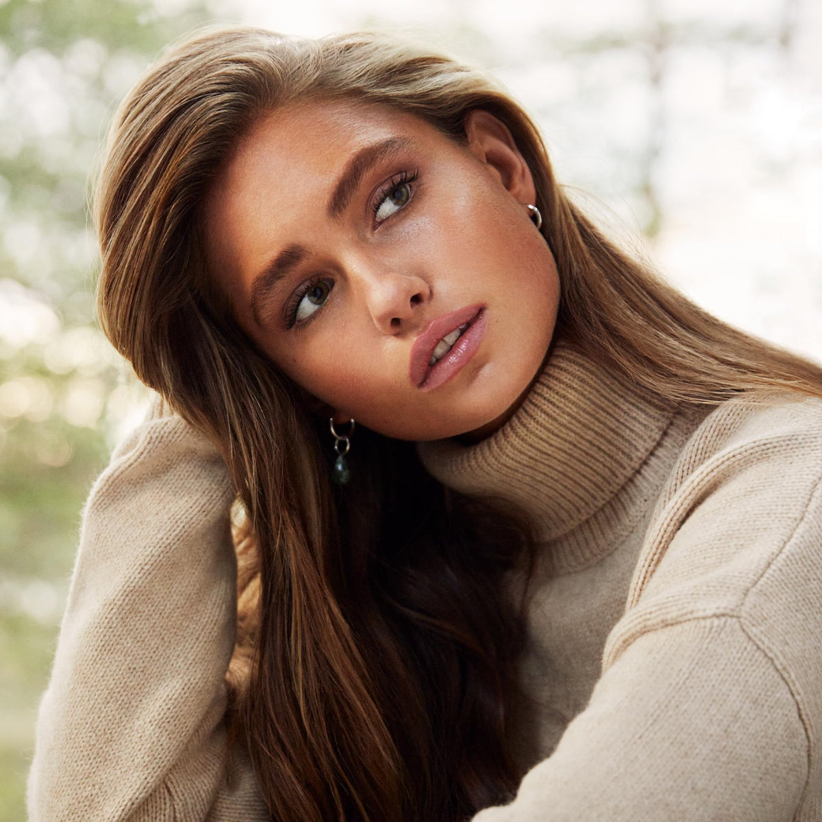 Styling with heat tools while SACHAJUAN Volume Cream forms protective barrier.