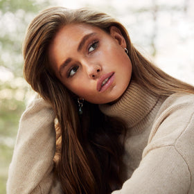 Styling with heat tools while SACHAJUAN Volume Cream forms protective barrier.