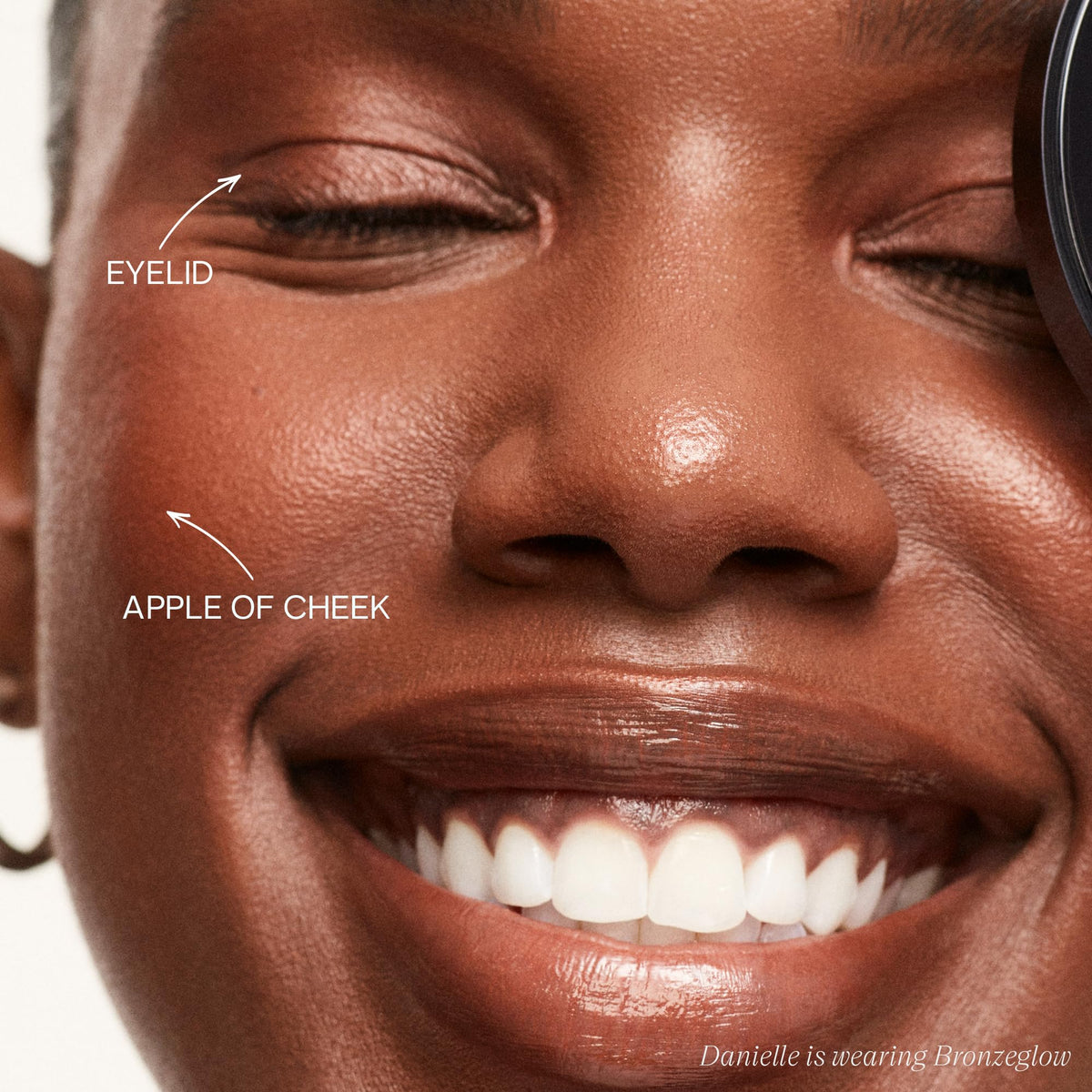 Saie Bronzeglow cream blush swatch reveals warm red bronze for sun-kissed flush.