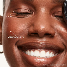 Saie Bronzeglow cream blush swatch reveals warm red bronze for sun-kissed flush.